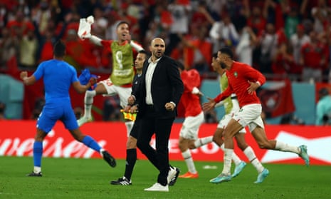 Moroccan coach Walid Regragui celebrates after the game.
