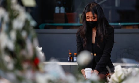 A woman pays tribute to the victims of the Halloween crowd crush, on an Itaewon street near to the scene.