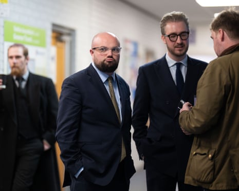 Reform UK candidate Llyr Powell, second from left, at the count