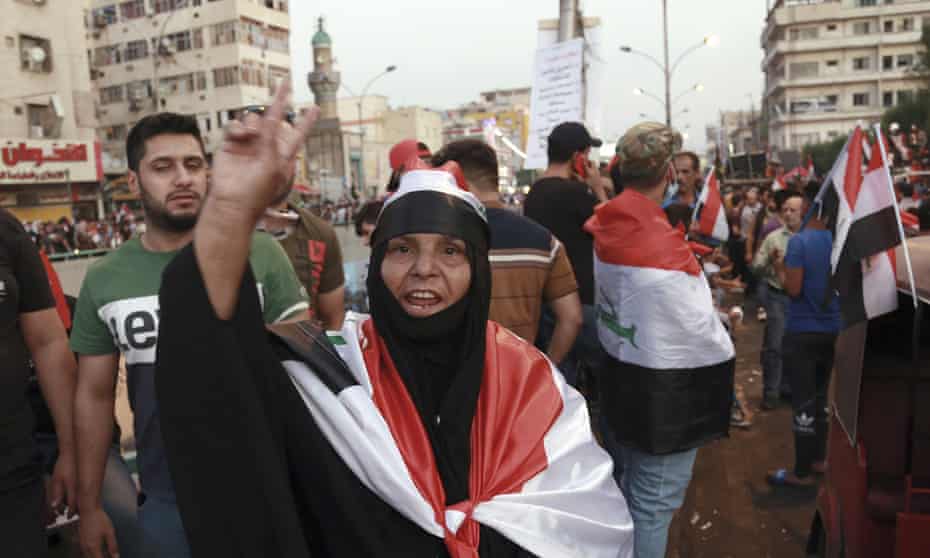 Anti-government protesters gather in Tahrir Square, Baghdad, during ongoing protests in Iraq on Friday.