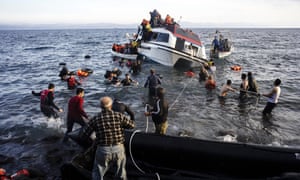 Local people on the island of Lesbos help bring migrants to safety