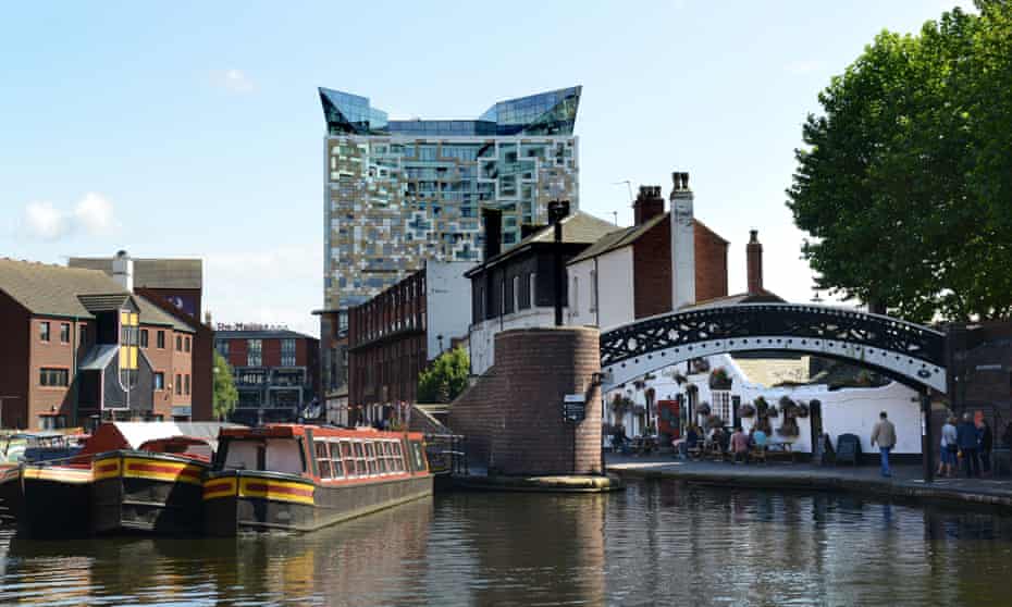 Birmingham old and new … narrowboats on Broad Street canal basin with the 25-storey Cube building behind.