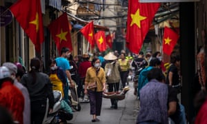 Shoppers wear face masks at a market in Hanoi
