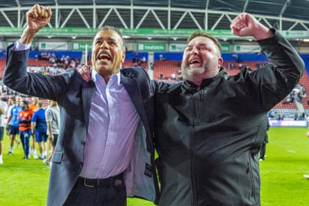 Owner Matt Ellis celebrates his clubâÂÂs victory over Wigan with former footballer and Wakefield supporter Chris Kamara