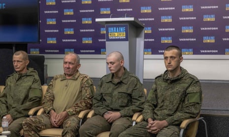Russian servicemen detained in Ukraine attend a briefing entitled “Treatment of captured Russian soldiers in Ukraine” in Kyiv.