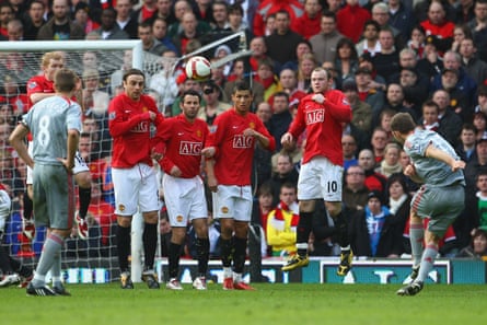 Fabio Aurelio curls in the free-kick for Liverpool’s third, after Nemanja Vidic had been sent off for a second yellow card, having fouled Steven Gerrard.