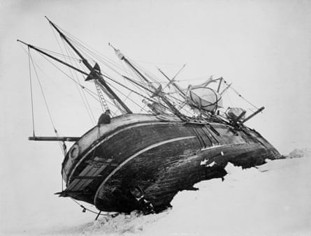 Black and white photo of Endurance listing on its side in pack ice
