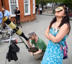 Sumitra Sri Bhashyam from Flamsteed Astronomy Society looks through protective glasses at the Royal Observatory in Greenwich, London, UK
