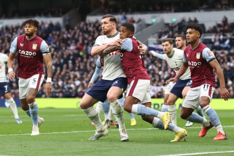 Pierre-Emile Hojbjerg of Tottenham Hotspur grapples with Leon Bailey of Aston Villa at a corner