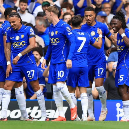 Chelsea players celebrate after scoring against Brighton