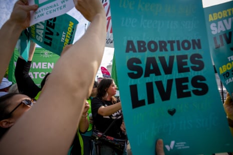 Protesters hold signs reading "Abortion Saves Lives" outside the supreme court