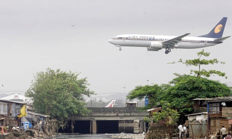 A Jet Airways plane flies into Mumbai airport