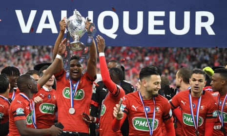 Rennes players celebrate after a raucous night in Paris.