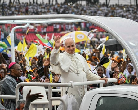 Pope Leo surrounded by a crowd of people.