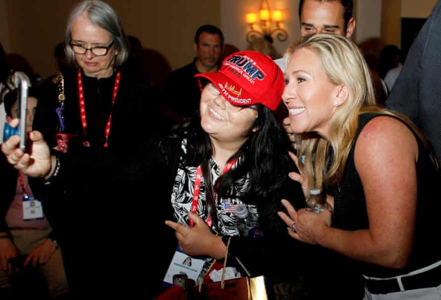 US congresswoman Marjorie Taylor Greene with a Trump supporter.