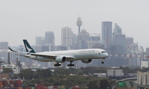 Coronavirus news live: South Korea reports daily Covid case record as Omicron variant hits 5 A Cathay Pacific Airways plane arrives in Sydney from Hong Kong on 30 November.