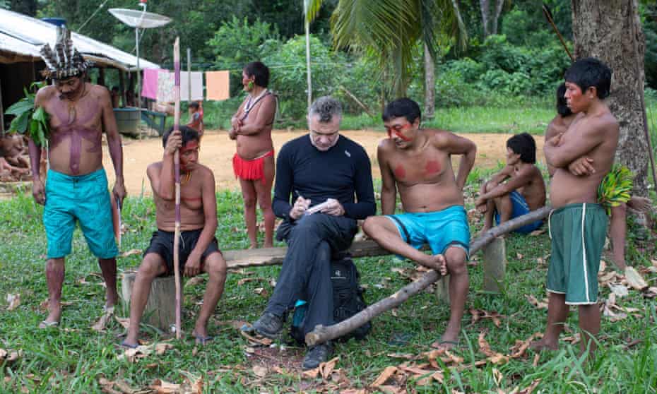 Dom Phillips takes notes as he talks with Indigenous people at the Aldeia Maloca Papiu, Roraima State, Brazil.