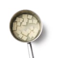Felicity Cloake’s Mapo Tofu... Blanching the tofu in a pan of water.