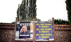 An electoral board showing France's far-right National Front president Marine Le Pen and reading: 100% National Front. 0% migrants is pictured during a demonstration  in Forges-les-Bains, south of Paris, France, Saturday, Oct. 8, 2016. French villagers are protesting the arrival of migrants who are being spread out around the country as the government shuts down the slum-like camp in Calais that has become a flashpoint in Europe’s migrant crisis. (AP Photo/Christophe Ena)