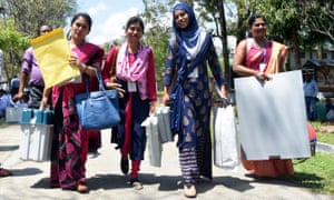 Indian polling officials leave for their polling booths in state of Assam.