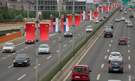 Chinese and Serbian flags on lamp-posts in Belgrade.