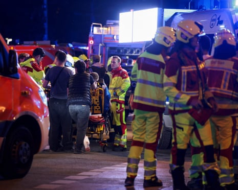Emergency responders at work after a car crashed into a crowd at Tiergarten park, Berlin.