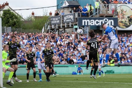 Elliot Anderson of Bristol Rovers scores their seventh goal against Scunthorpe in 2022, sealing promotion.