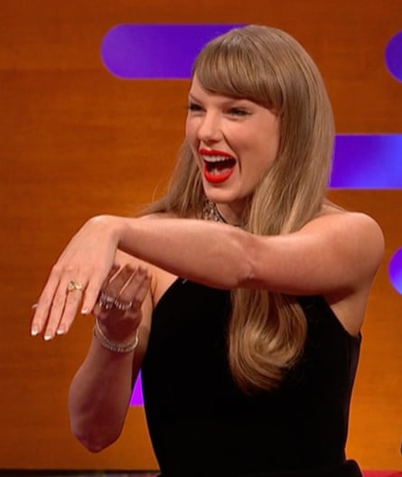 Taylor Swift shows off her engagement ring.