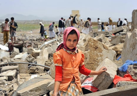 A young Yemeni poses in front of the ruins of her family house a day after it was destroyed by an air strike carried out by the Saudi-led coalition in Sana'a.