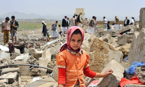 A Yemeni girl in the ruins of a house destroyed by Saudi-led airstrikes in Sanaa, June 2015