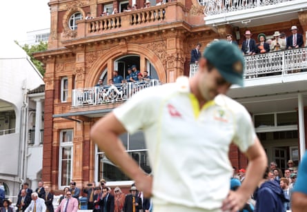 Pat Cummins with the England team behind during the second Ashes Test in 2023.