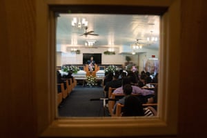 Pastor James Parker speaks at a double funeral service for Lola M. Simmons-Jones and her daughter Lashaye Antoinette Allen, at the Denley Drive Missionary Baptist Church in Dallas on July 30, 2020, who both died of coronavirus.