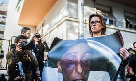 Ilaria Cucchi with photograph of  brother’s body