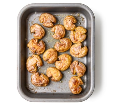 05a Felicity Cloake’s perfect roast new potatoes: Roast for 20 minutes, or until richly golden brown underneath (larger potatoes may take longer), then flip over and bake for another 10 minutes. Serve immediately.