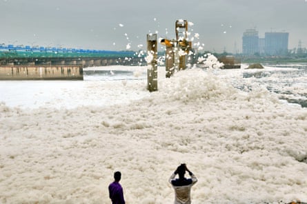 A sea of foam gathers at the banks of the Yamuna river in Noida, India