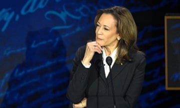 Kamala Harris listens as Donald Trump speaks during a presidential debate.