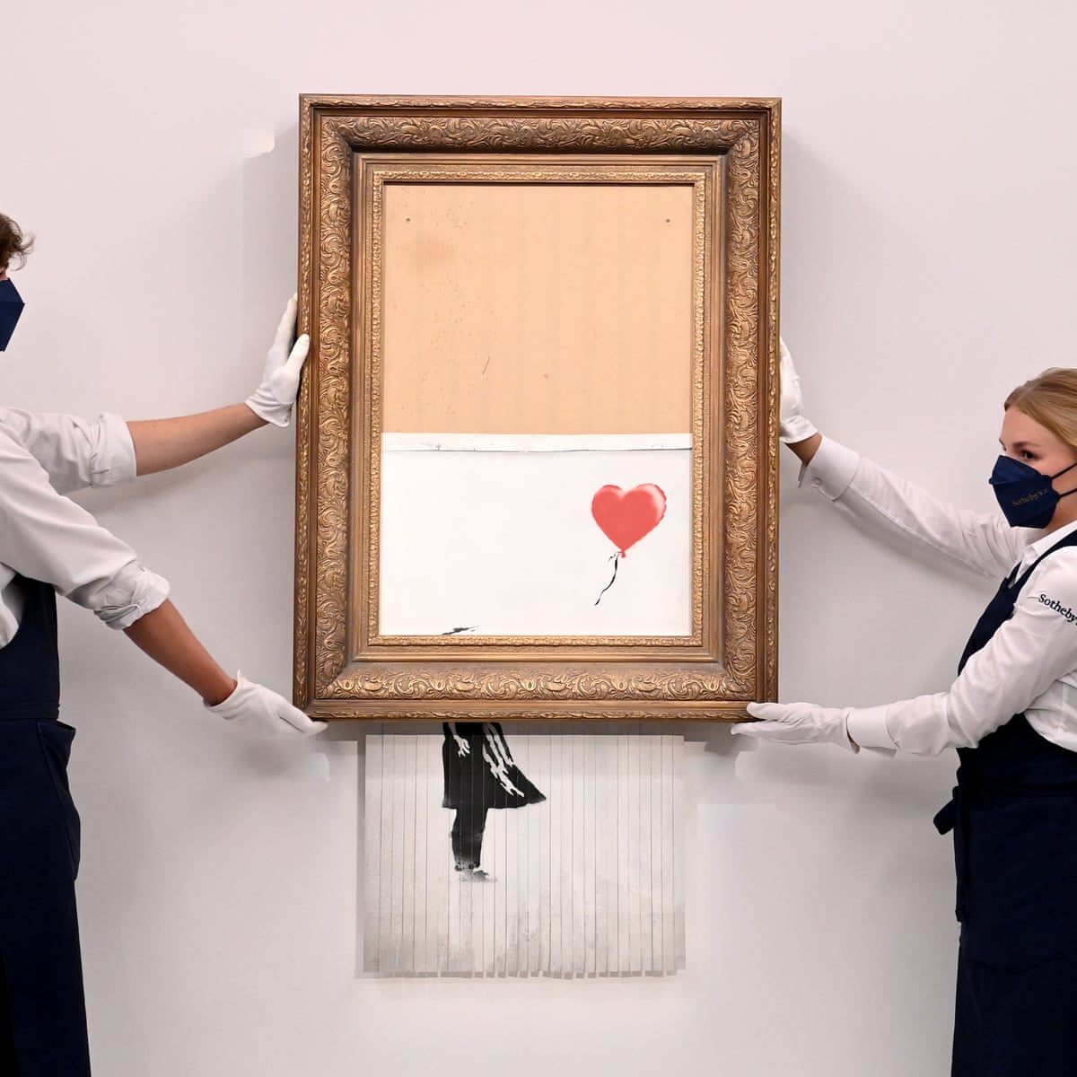banksy sets auction record with 18 5m sale of shredded painting banksy the guardian