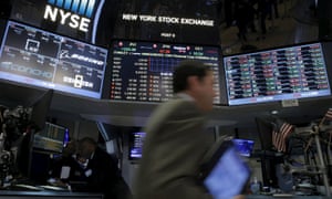 Traders work at the New York Stock Exchange