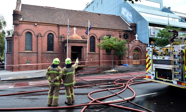Firefighters survey the scene of a fire at the Annunciation of Our Lady Greek Orthodox Church in Melbourne.