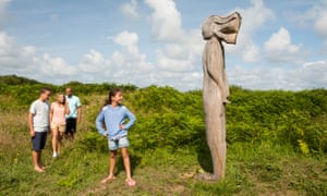 A family group enjoys a nature trail at the Kenfig reserve.