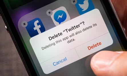 Person deletes Twitter from smartphone