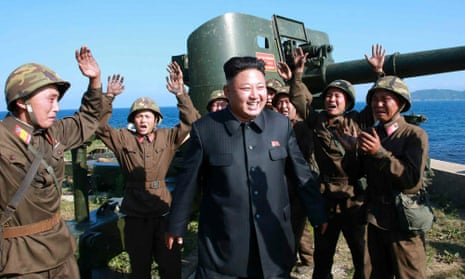 North Korean leader Kim Jong-un is surrounded by cheering soldiers as he is touring a frontline military detachment.