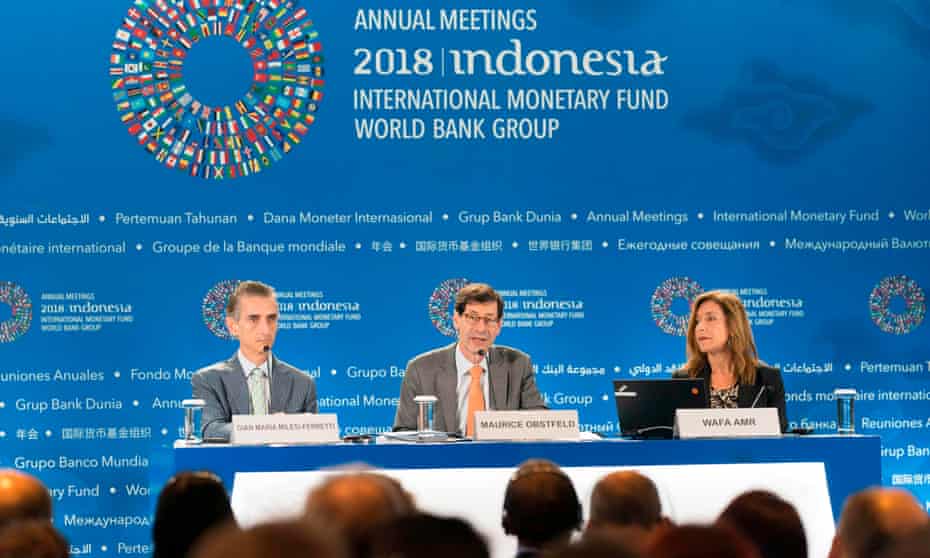 The IMF’s Maurice Obstfeld (C) with deputy director Gian Maria Milesi-Ferretti and communications officer Wafa Amr (R) at the conference in Bali.