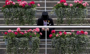 A racegoer in the stands at Ascot.