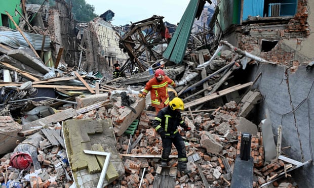 Rescue teams dig through rubble of buildings destroyed attacks in Kharkiv