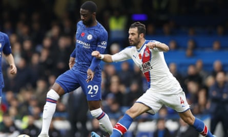 Crystal Palace's Luka Milivojevic (right) challenges Chelsea's Fikayo Tomori during their Premier League match at Stamford Bridge.