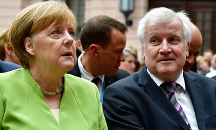 Angela Merkel and her interior minister Horst Seehofer, who could bring down the German government.