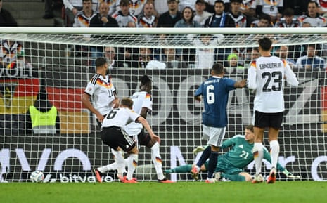 Greece's Dimitrios Kourbelis scores their first goal.