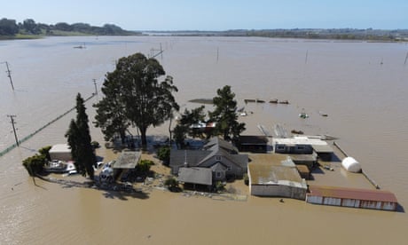 Late Spring weather systems affect both U.S. coasts<br>A home is surrounded by floodwaters from the Pajaro River after days of heavy rain in Pajaro, California, U.S., March 15, 2023.  REUTERS/David Swanson
