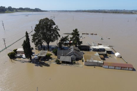 A home is surrounded by floodwaters from the Pajaro River after days of heavy rain in Pajaro, California.